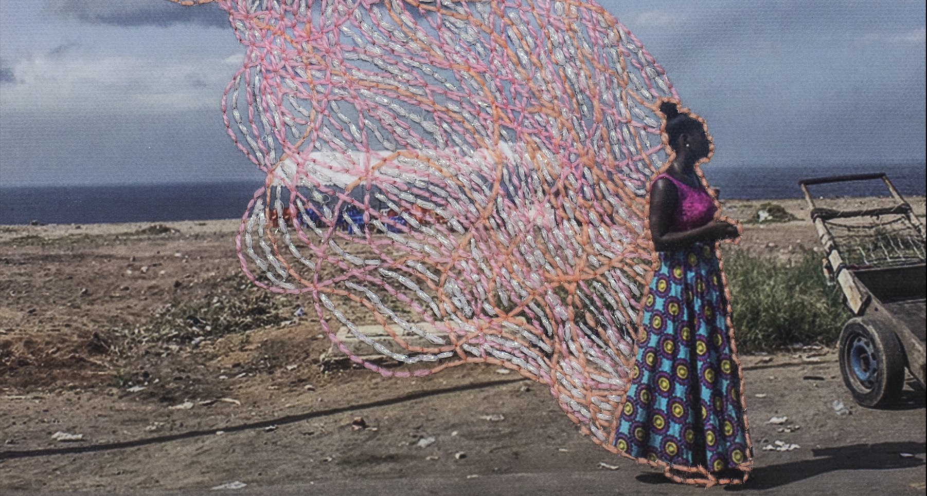 On the right you see a woman who appears to leave a trace of color. This color is made with physical embroidery thread in light pinks and orange. The backdrop is a vast landscape.